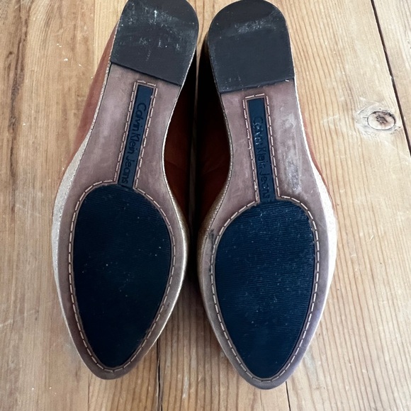 Brown leather wedge loafer
By Calvin Klein Jeans - Picture 7 of 9